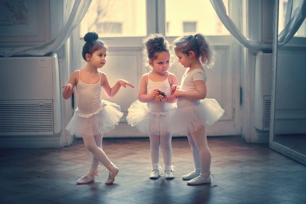 Three,Funny,Little,Ballerinas,Are,Eating,Chocolate,Candies,In,The